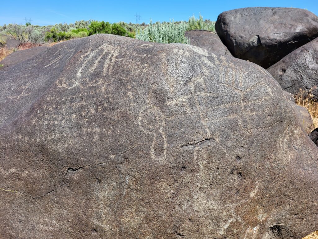 Petrified watermelons, formally called melon boulders, near the Snake River. Petroglyphs carved on the rock depict different symbols. 